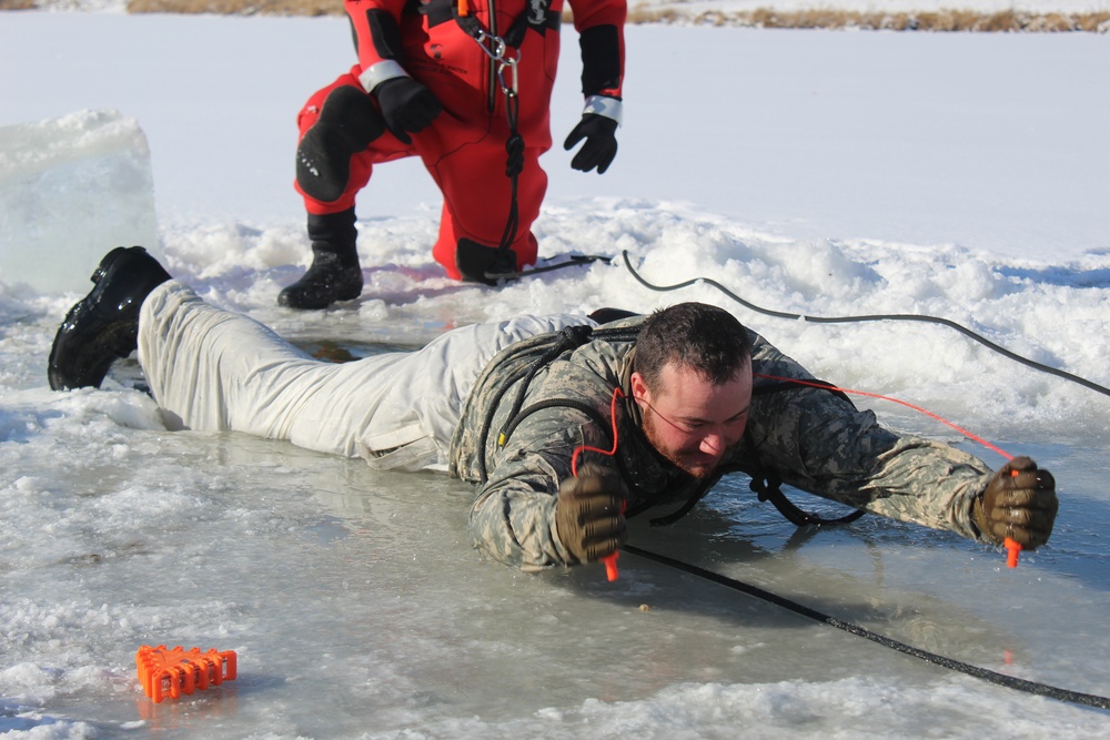 Students take plunge in icy water for Cold-Weather Operations Course 18-02 at Fort McCoy