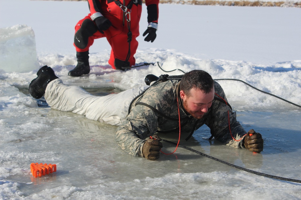 Students take plunge in icy water for Cold-Weather Operations Course 18-02 at Fort McCoy