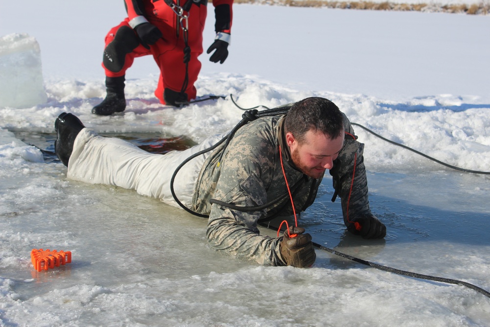 Students take plunge in icy water for Cold-Weather Operations Course 18-02 at Fort McCoy