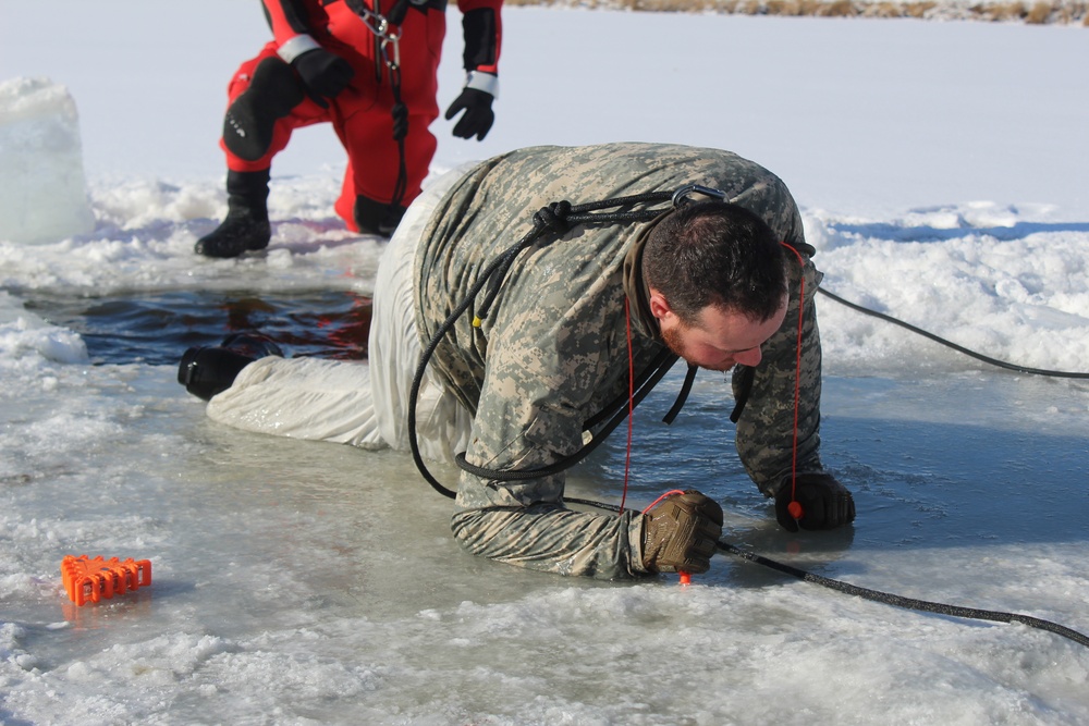 Students take plunge in icy water for Cold-Weather Operations Course 18-02 at Fort McCoy