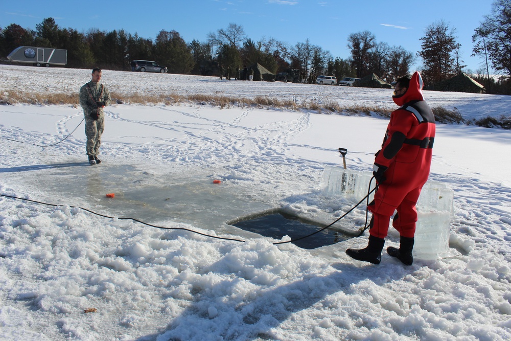 Students take plunge in icy water for Cold-Weather Operations Course 18-02 at Fort McCoy