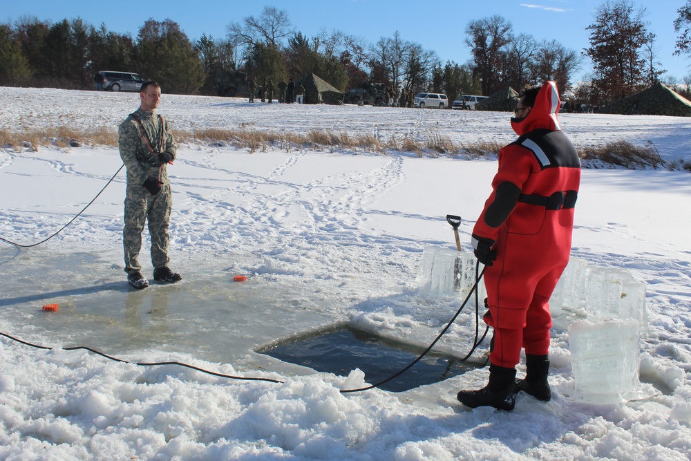 Students take plunge in icy water for Cold-Weather Operations Course 18-02 at Fort McCoy