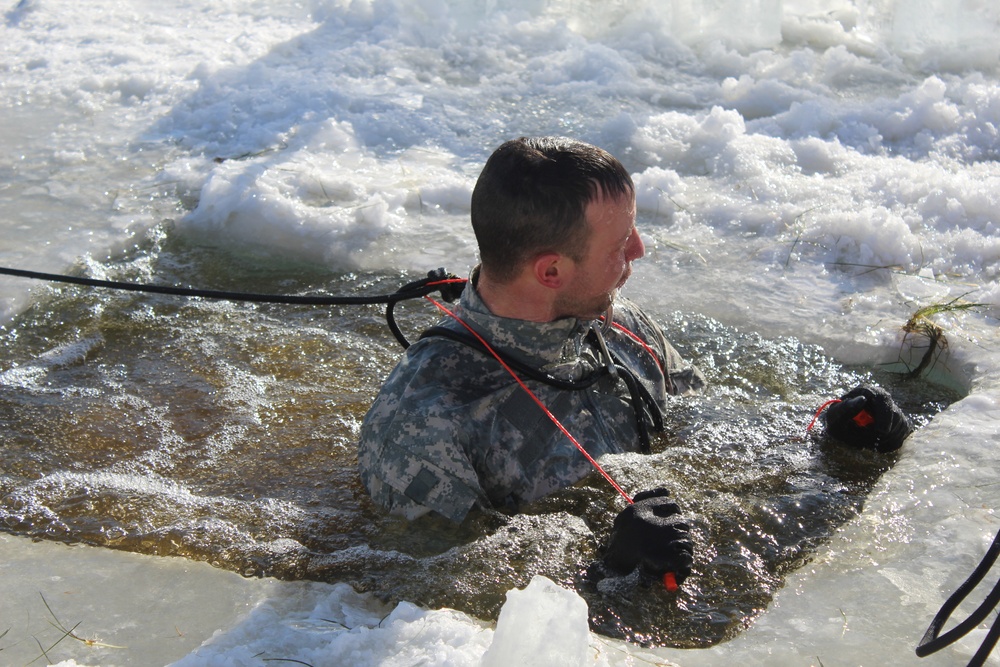 Students take plunge in icy water for Cold-Weather Operations Course 18-02 at Fort McCoy