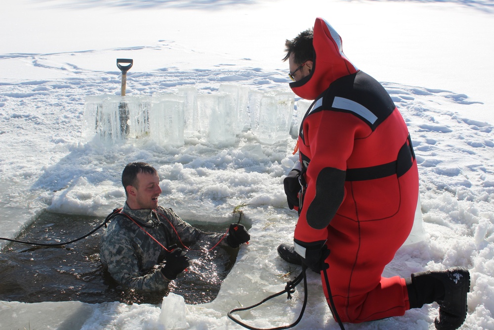 Students take plunge in icy water for Cold-Weather Operations Course 18-02 at Fort McCoy