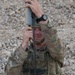 Cav scout sets up Raven antenna during battlefield exercise