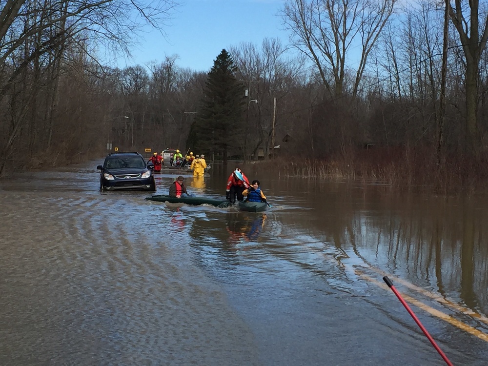 Coast Guard members help evacuate