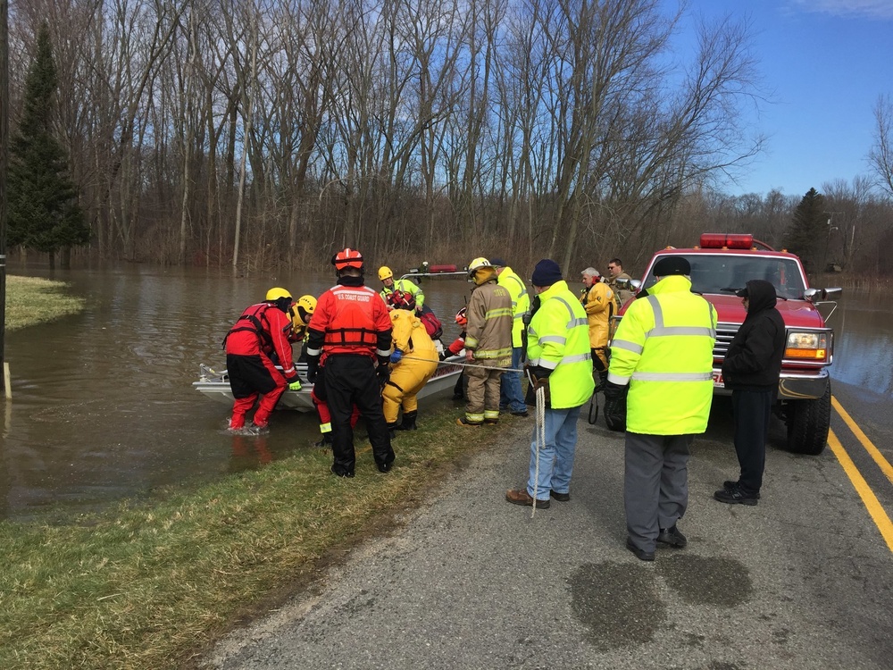 Coast Guard members evacuate local residents in St. Joseph, Michigan