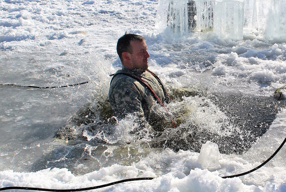 Students take plunge in icy water for Cold-Weather Operations Course 18-02 at Fort McCoy