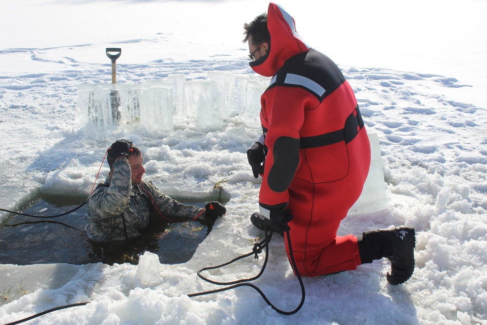 Students take plunge in icy water for Cold-Weather Operations Course 18-02 at Fort McCoy