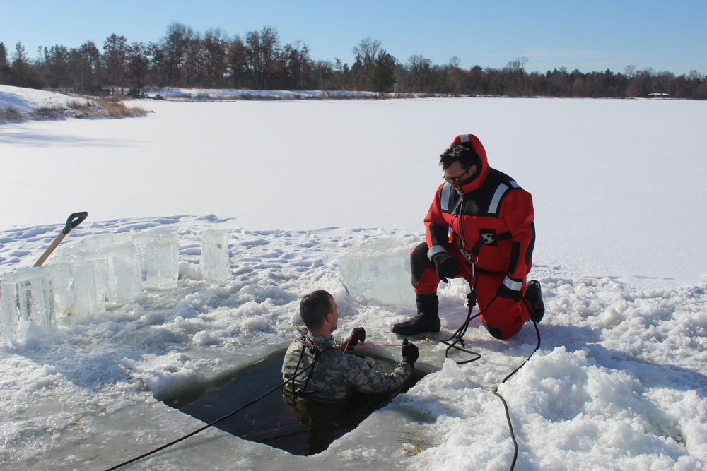 Students take plunge in icy water for Cold-Weather Operations Course 18-02 at Fort McCoy