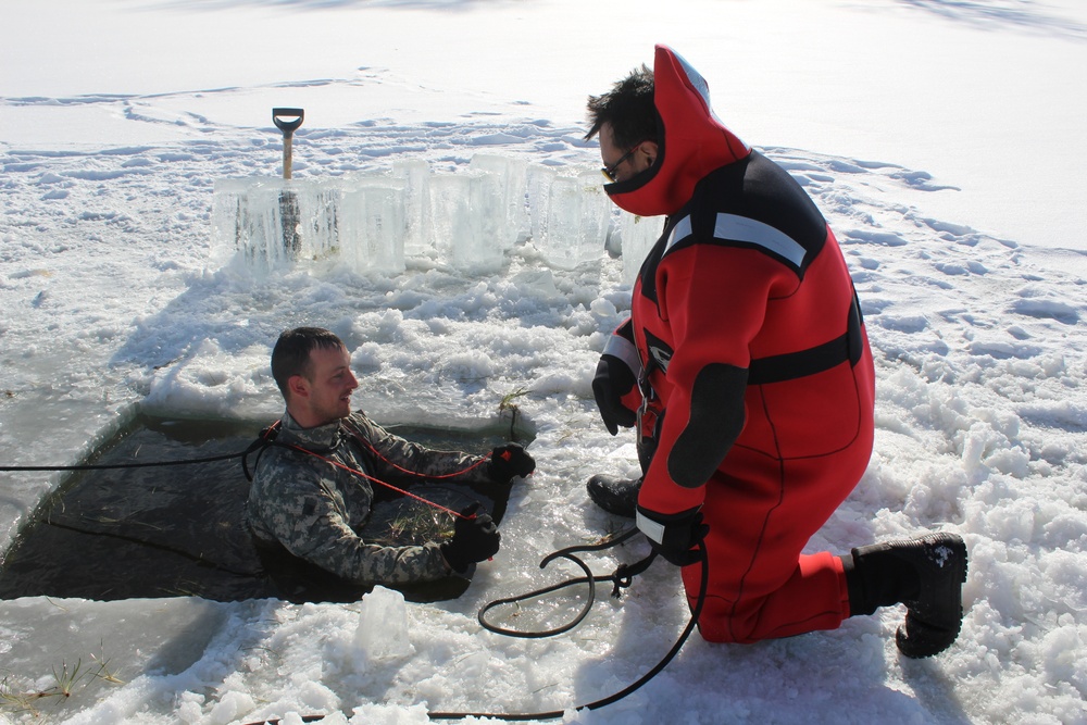 Students take plunge in icy water for Cold-Weather Operations Course 18-02 at Fort McCoy