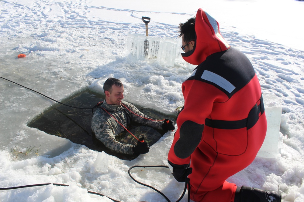 Students take plunge in icy water for Cold-Weather Operations Course 18-02 at Fort McCoy