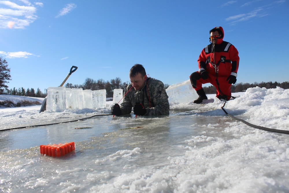 Students take plunge in icy water for Cold-Weather Operations Course 18-02 at Fort McCoy