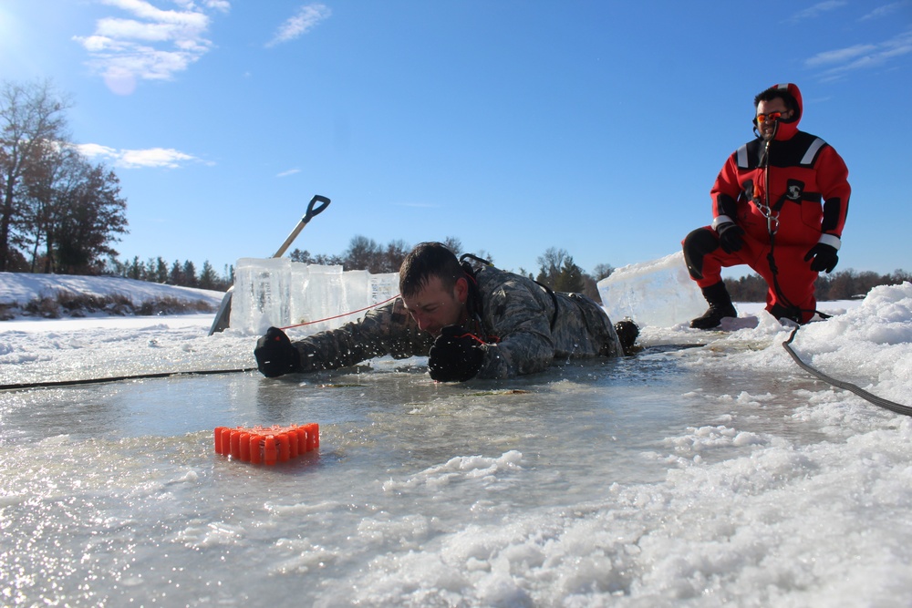 Students take plunge in icy water for Cold-Weather Operations Course 18-02 at Fort McCoy