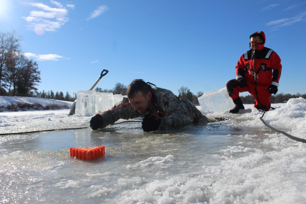 Students take plunge in icy water for Cold-Weather Operations Course 18-02 at Fort McCoy