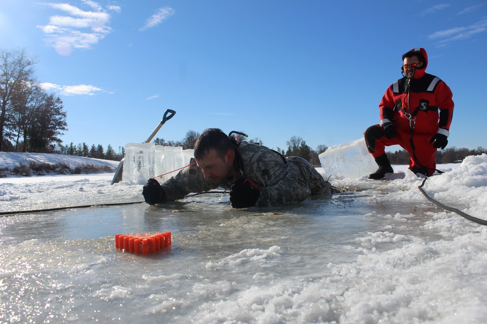 Students take plunge in icy water for Cold-Weather Operations Course 18-02 at Fort McCoy