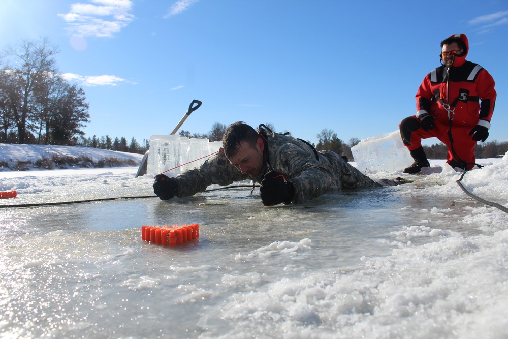 Students take plunge in icy water for Cold-Weather Operations Course 18-02 at Fort McCoy