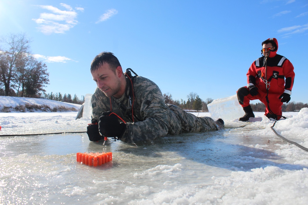 Students take plunge in icy water for Cold-Weather Operations Course 18-02 at Fort McCoy