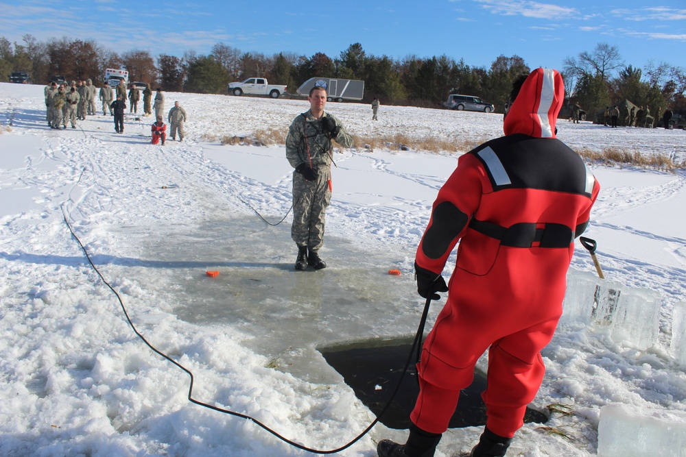 Students take plunge in icy water for Cold-Weather Operations Course 18-02 at Fort McCoy