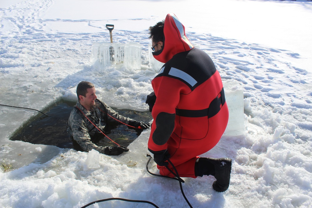 Students take plunge in icy water for Cold-Weather Operations Course 18-02 at Fort McCoy