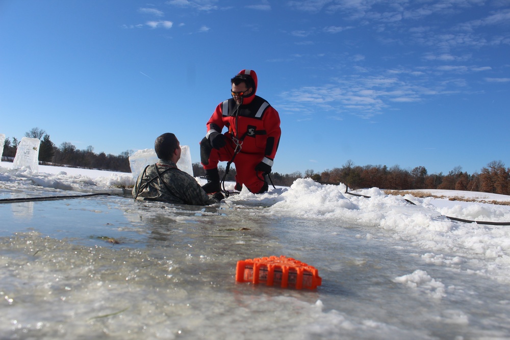 Students take plunge in icy water for Cold-Weather Operations Course 18-02 at Fort McCoy