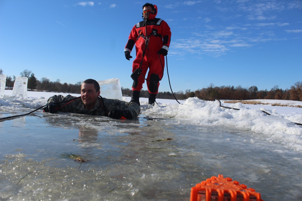 Students take plunge in icy water for Cold-Weather Operations Course 18-02 at Fort McCoy