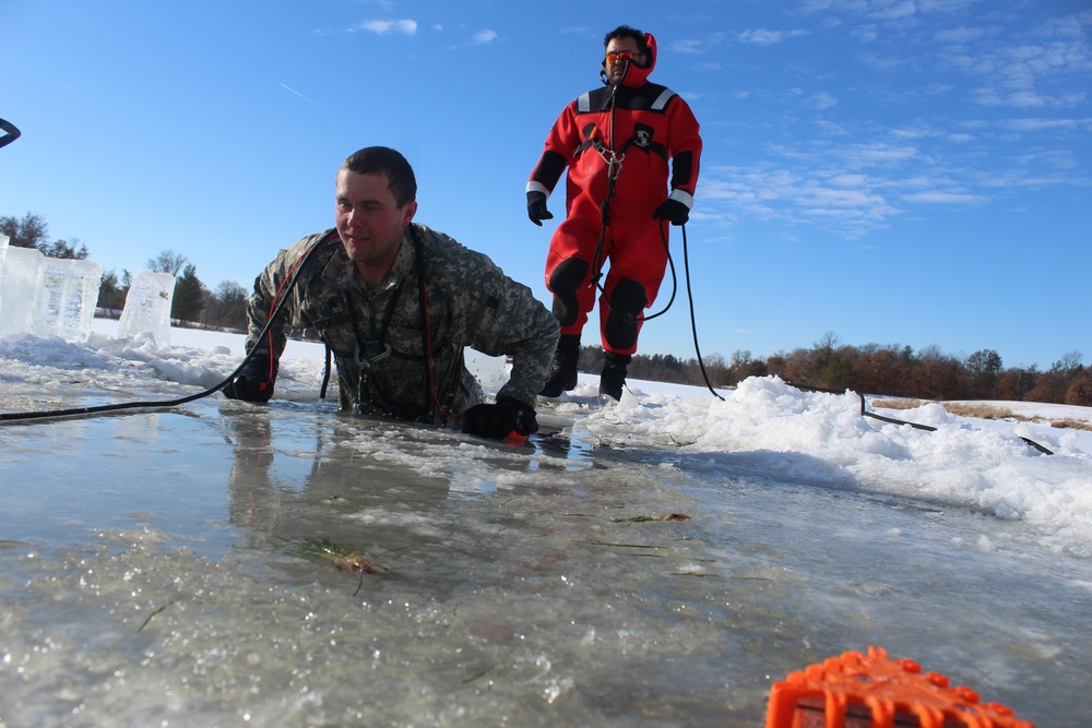 Students take plunge in icy water for Cold-Weather Operations Course 18-02 at Fort McCoy