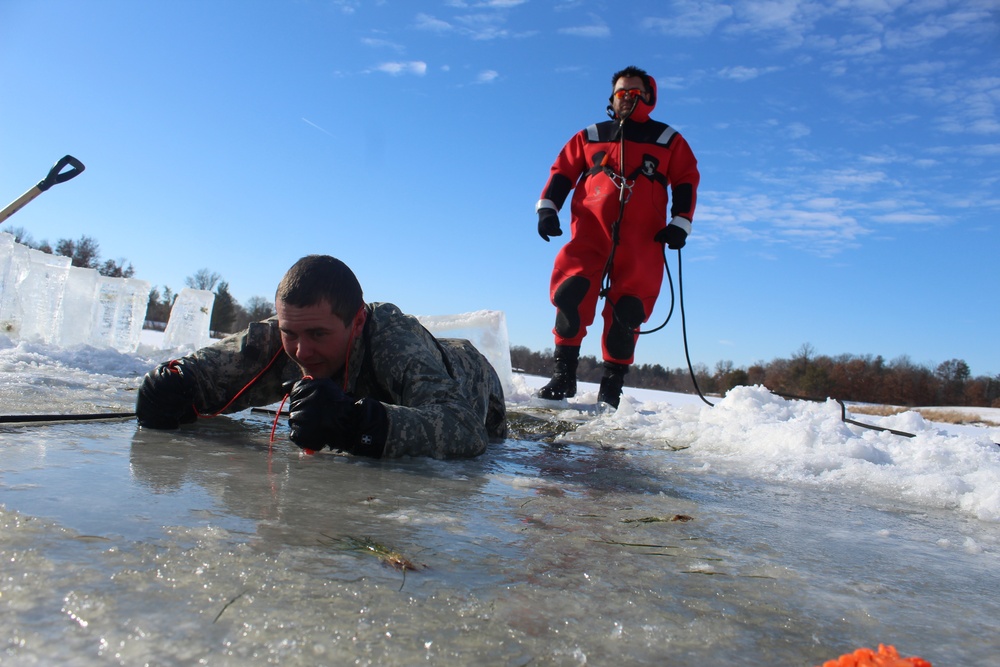 Students take plunge in icy water for Cold-Weather Operations Course 18-02 at Fort McCoy