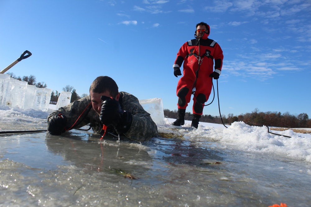 Students take plunge in icy water for Cold-Weather Operations Course 18-02 at Fort McCoy