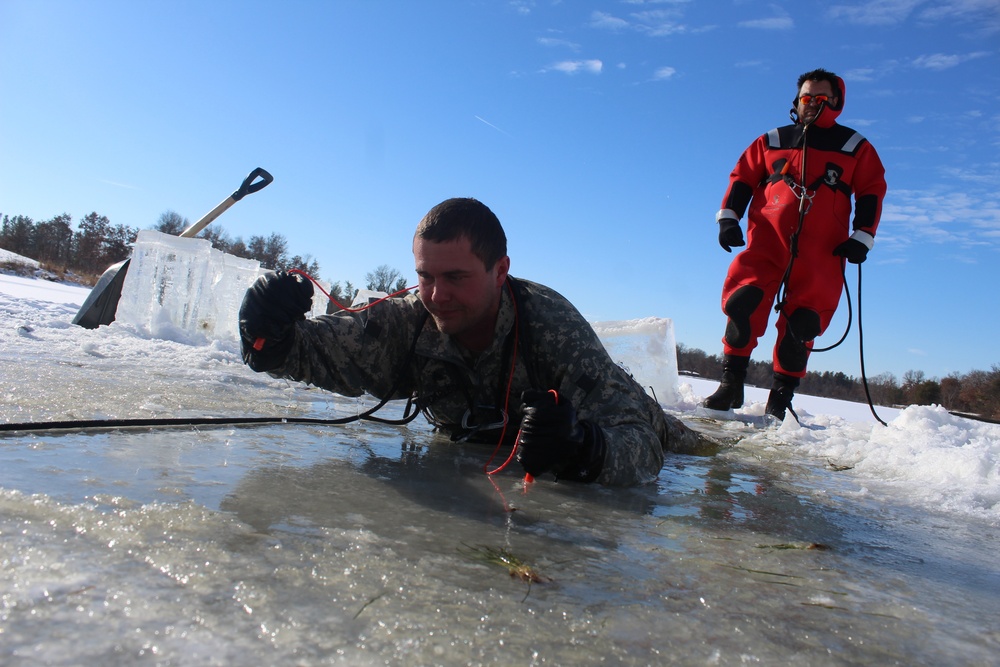 Students take plunge in icy water for Cold-Weather Operations Course 18-02 at Fort McCoy