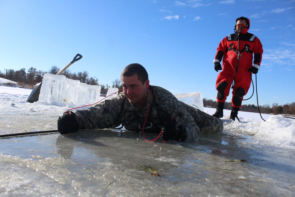 Students take plunge in icy water for Cold-Weather Operations Course 18-02 at Fort McCoy