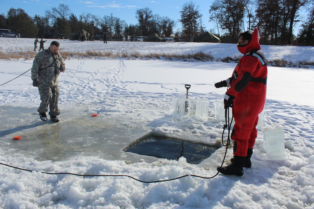 Students take plunge in icy water for Cold-Weather Operations Course 18-02 at Fort McCoy