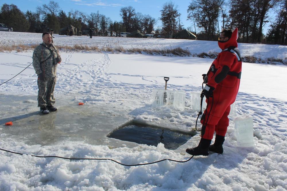 Students take plunge in icy water for Cold-Weather Operations Course 18-02 at Fort McCoy