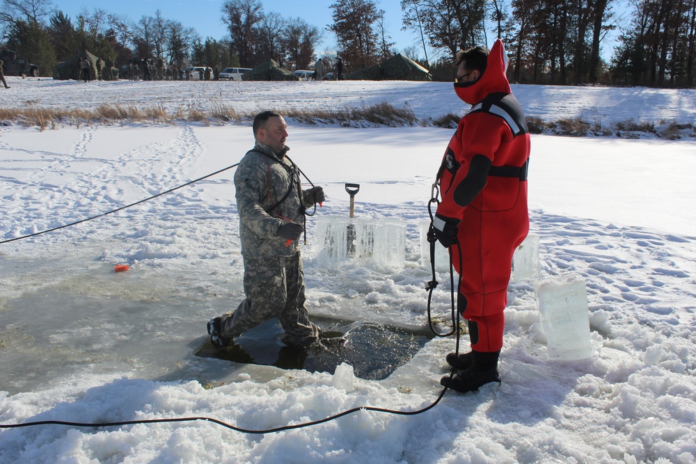 Students take plunge in icy water for Cold-Weather Operations Course 18-02 at Fort McCoy