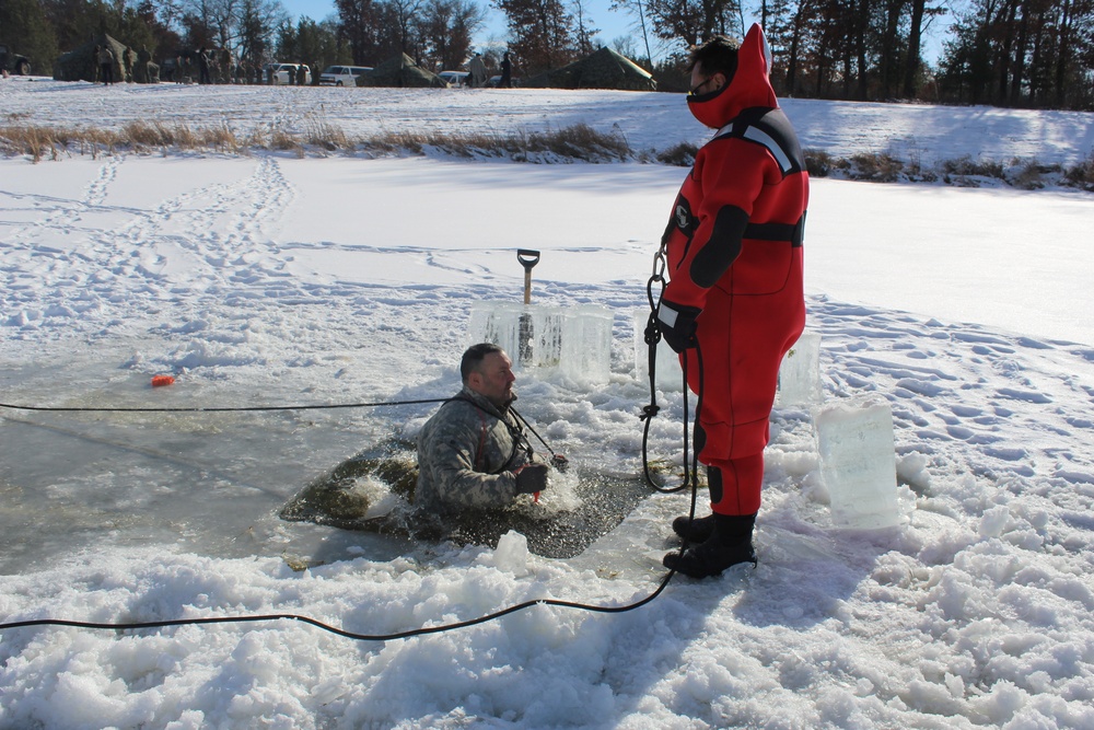 Students take plunge in icy water for Cold-Weather Operations Course 18-02 at Fort McCoy