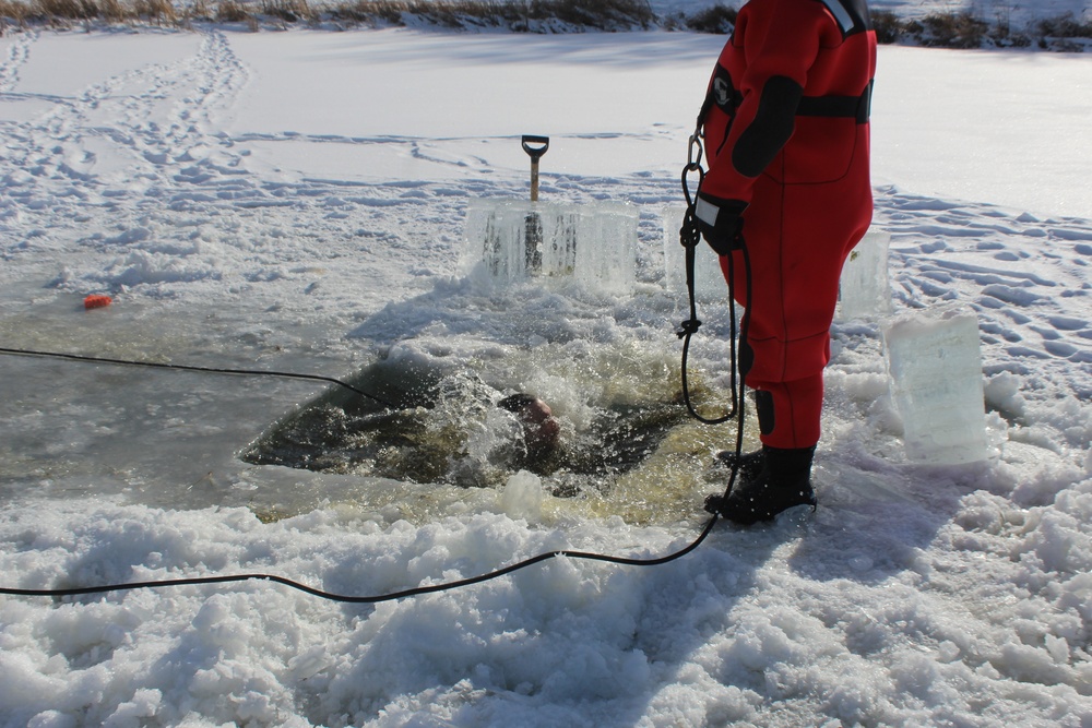 Students take plunge in icy water for Cold-Weather Operations Course 18-02 at Fort McCoy