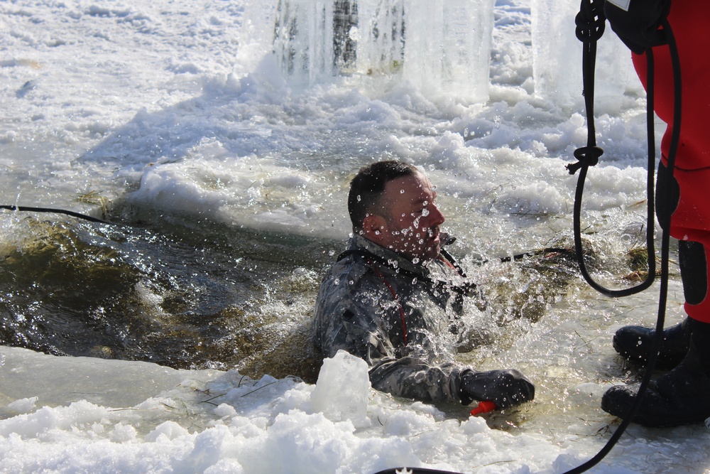 Students take plunge in icy water for Cold-Weather Operations Course 18-02 at Fort McCoy