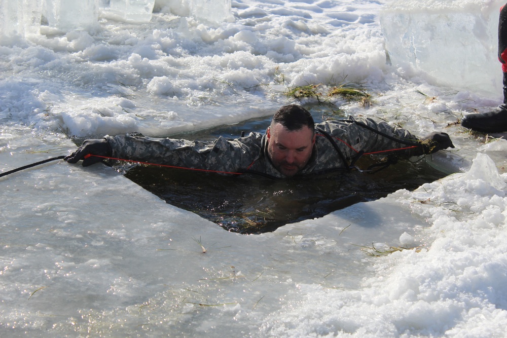 Students take plunge in icy water for Cold-Weather Operations Course 18-02 at Fort McCoy