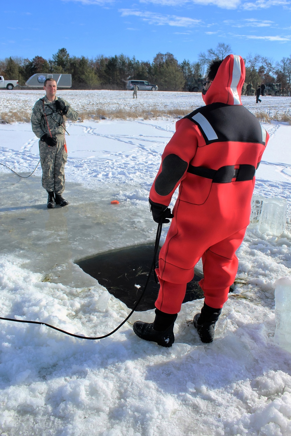 Students take plunge in icy water for Cold-Weather Operations Course 18-02 at Fort McCoy