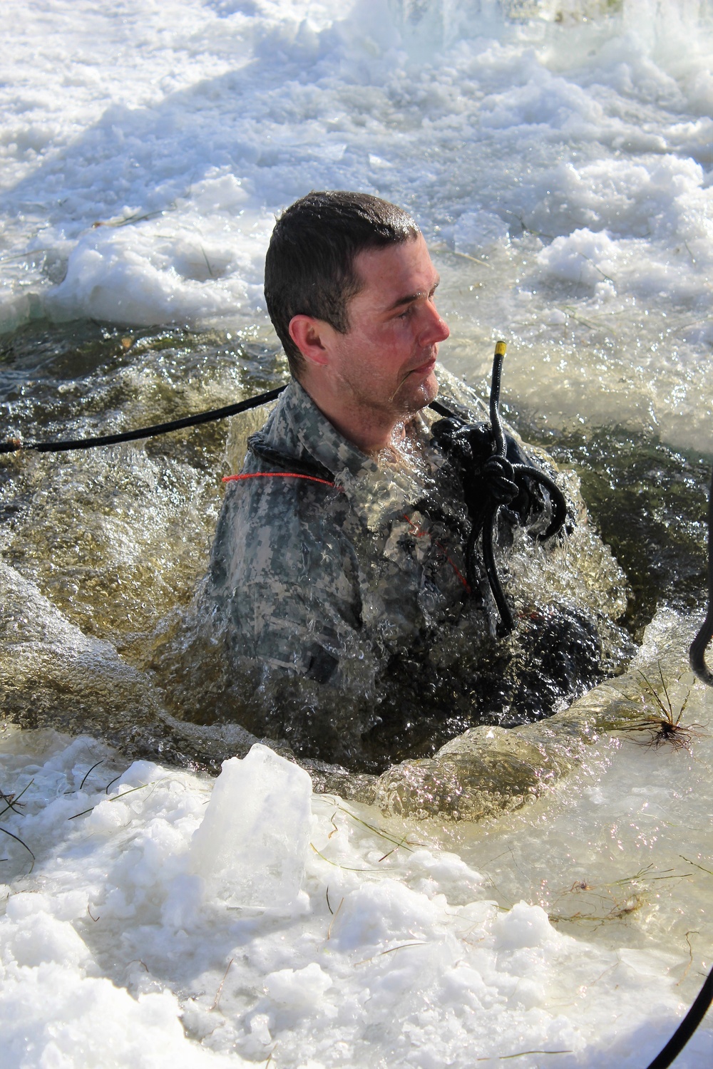 Students take plunge in icy water for Cold-Weather Operations Course 18-02 at Fort McCoy