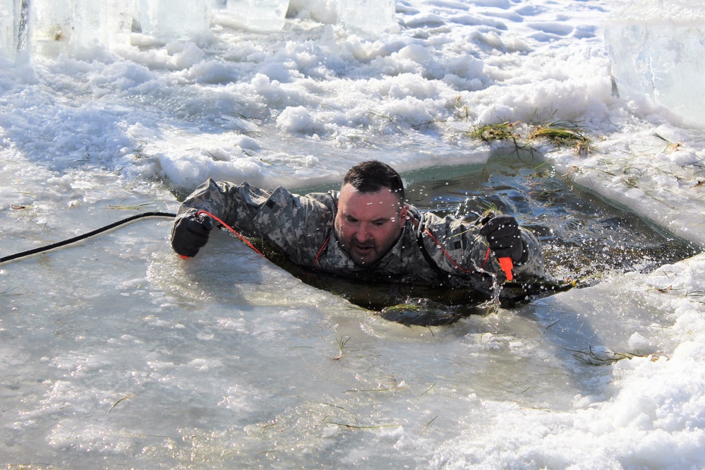 Students take plunge in icy water for Cold-Weather Operations Course 18-02 at Fort McCoy