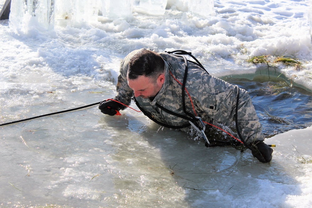 Students take plunge in icy water for Cold-Weather Operations Course 18-02 at Fort McCoy