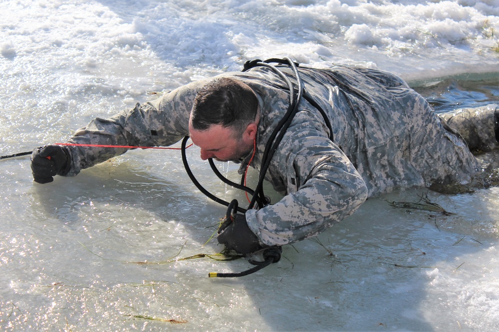 Students take plunge in icy water for Cold-Weather Operations Course 18-02 at Fort McCoy