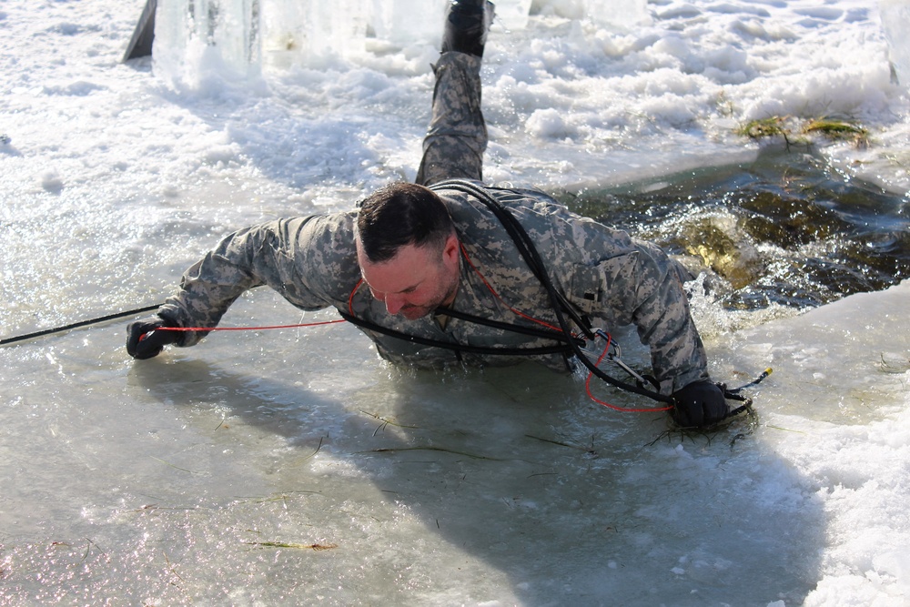 Students take plunge in icy water for Cold-Weather Operations Course 18-02 at Fort McCoy