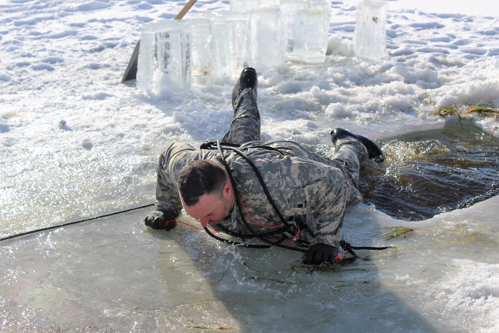 Students take plunge in icy water for Cold-Weather Operations Course 18-02 at Fort McCoy