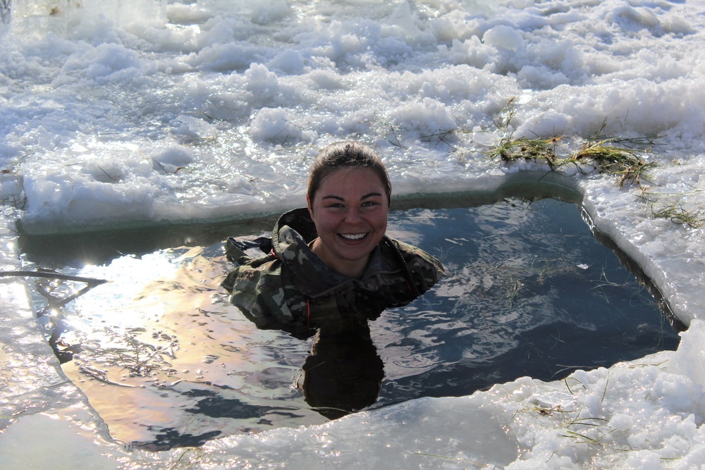 Students take plunge in icy water for Cold-Weather Operations Course 18-02 at Fort McCoy