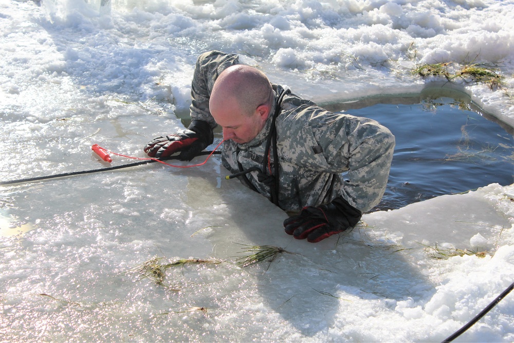 Students take plunge in icy water for Cold-Weather Operations Course 18-02 at Fort McCoy