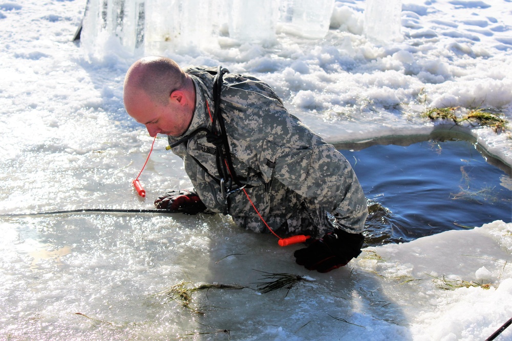 Students take plunge in icy water for Cold-Weather Operations Course 18-02 at Fort McCoy