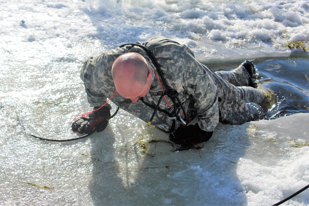 Students take plunge in icy water for Cold-Weather Operations Course 18-02 at Fort McCoy