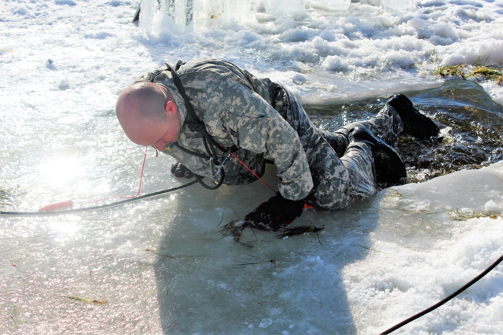 Students take plunge in icy water for Cold-Weather Operations Course 18-02 at Fort McCoy